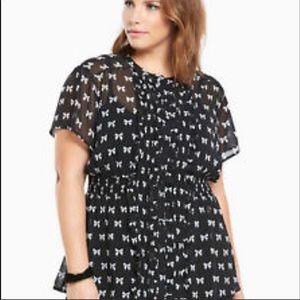 Torrid Sheer black button blouse with bows.